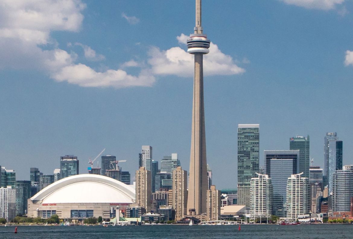 A view of the Toronto skyline taken from Toronto Harbour in summer 2018, with the CN Tower featured prominently.