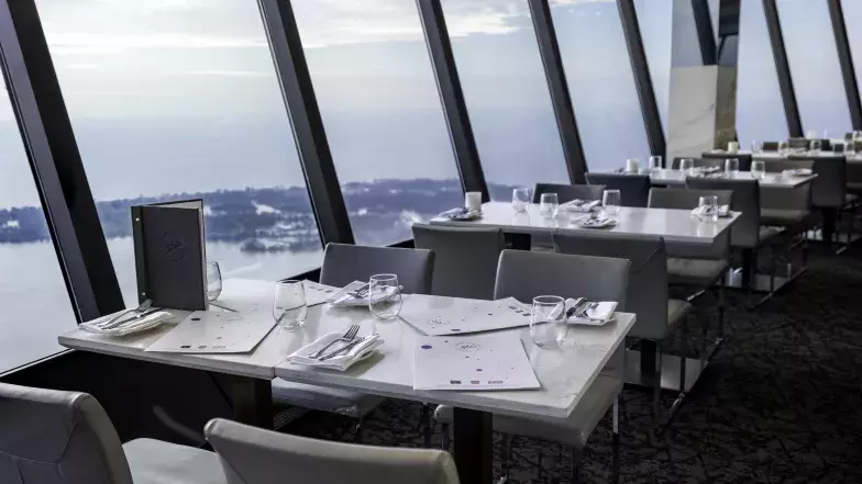 View of a full table set at 360 Restaurant, ready to welcome guests.