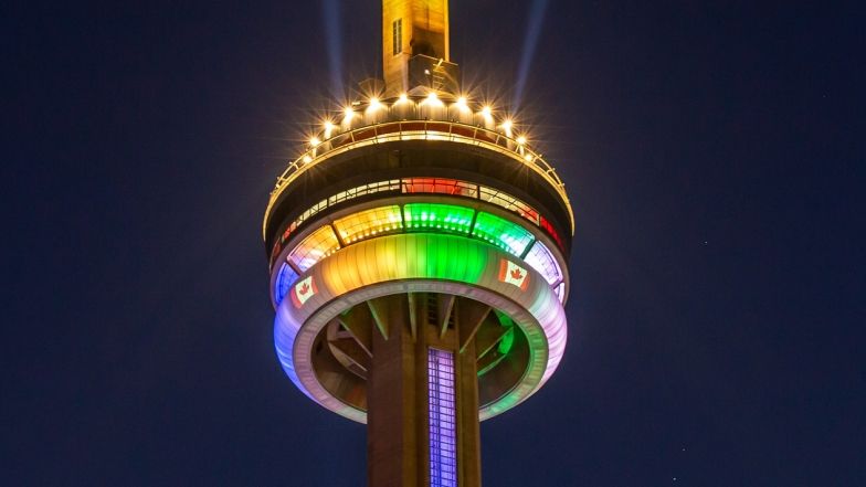 top of the tower with colourful lights. The elevator shaft is also lit up