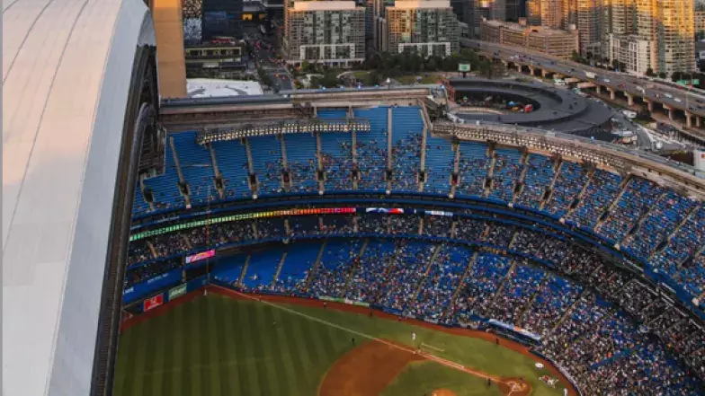 Aerial view of the baseball diamond with the roof open. Crowds are in the stadium.