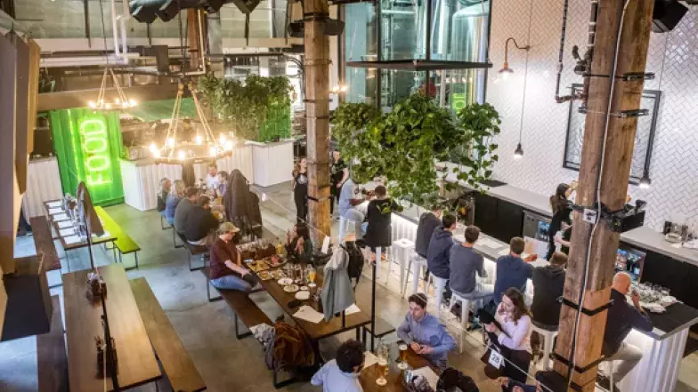 Birds eye view of people sitting at the bar, bar style tables