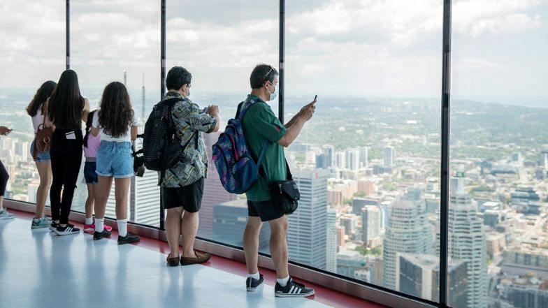A group of people taking photos from the observation deck